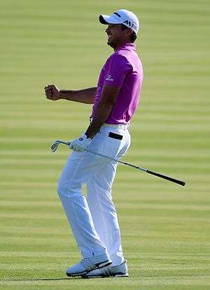Day celebrates after his birdie putt on the 12th hole drops. PHOTO: Rob Carr/Getty Images.