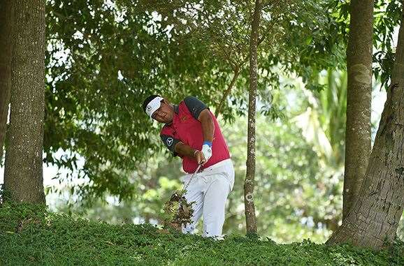 Thailand's Prom Meesawat escapes from trouble during the final round. PHOTO: Asian Tour/Khalid Redza