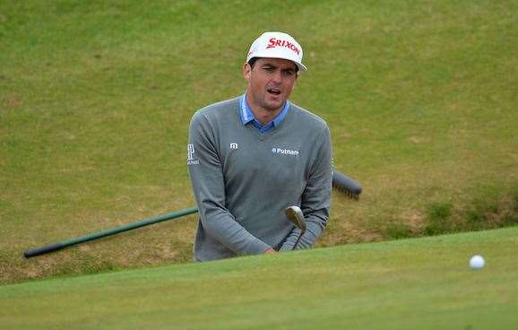 Former PGA Champion Keegan Bradley struggles to get out of a greenside bunker on the 8th hole during practice yesterday. PHOTO: Glyn Kirk/AFP/Getty Images.