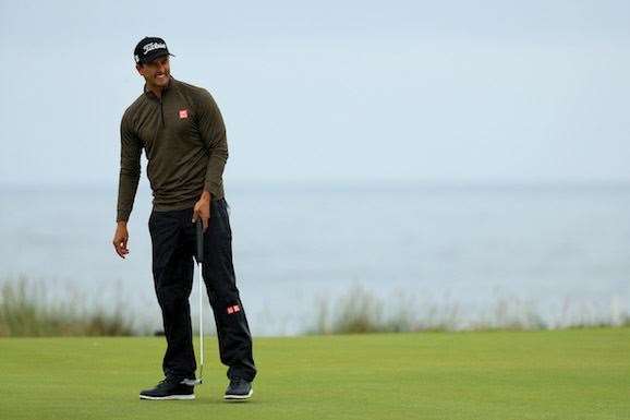 A frustrated Adam Scott watches another putt burn the edge of the hole. PHOTO: Mike Ehrmann/Getty Images.