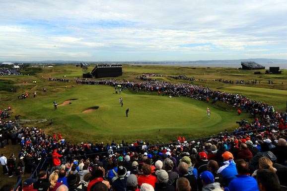The gallery ring the 14th hole as the duel reaches its climax in the final round. PHOTO: Mike Ehrmann/Getty Images.