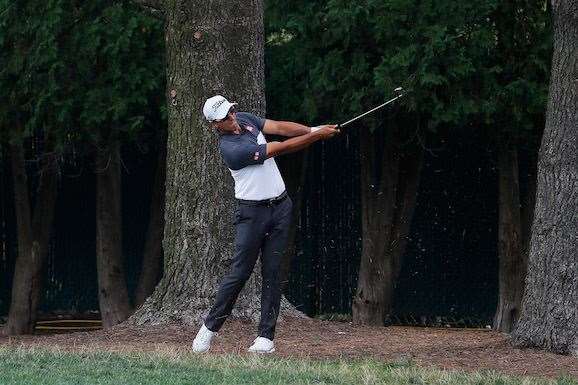 Adam Scott plays a recovery shot on the 2nd hole. He will resume his third round on the 5th hole. PHOTO: Kevin C. Cox/Getty Images.