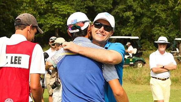 Golf Australia’s high performance director Brad James hugs Lee aftre his victory. PHOTO: USGA/Darren Carroll.