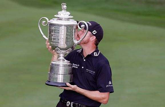 American Jimmy Walker celebrates his maiden major victory with the Wanamaker Trophy. PHOTO: Andy Lyons/Getty Images.