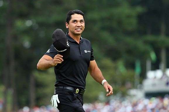 Jason Day tips his cap to the crowd after making an eagle at the final hole to pull within a shot of Walker. PHOTO: Andrew Redington/Getty Images