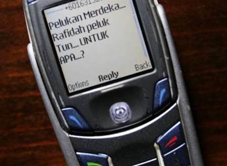 FEATURE - Asia tries to put SMS genie back in its bottle