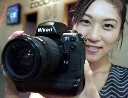 Nikon Q2 net profit tumbles, outlook maintained