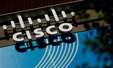 Cisco raises full-year outlook; announces restructure