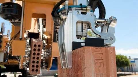 This robot lays 1,000 bricks an hour and can build a house in two days