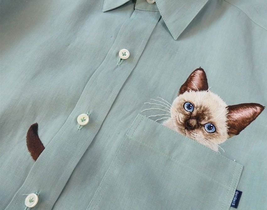 hiroko kubota embroiders cats onto shirt pockets