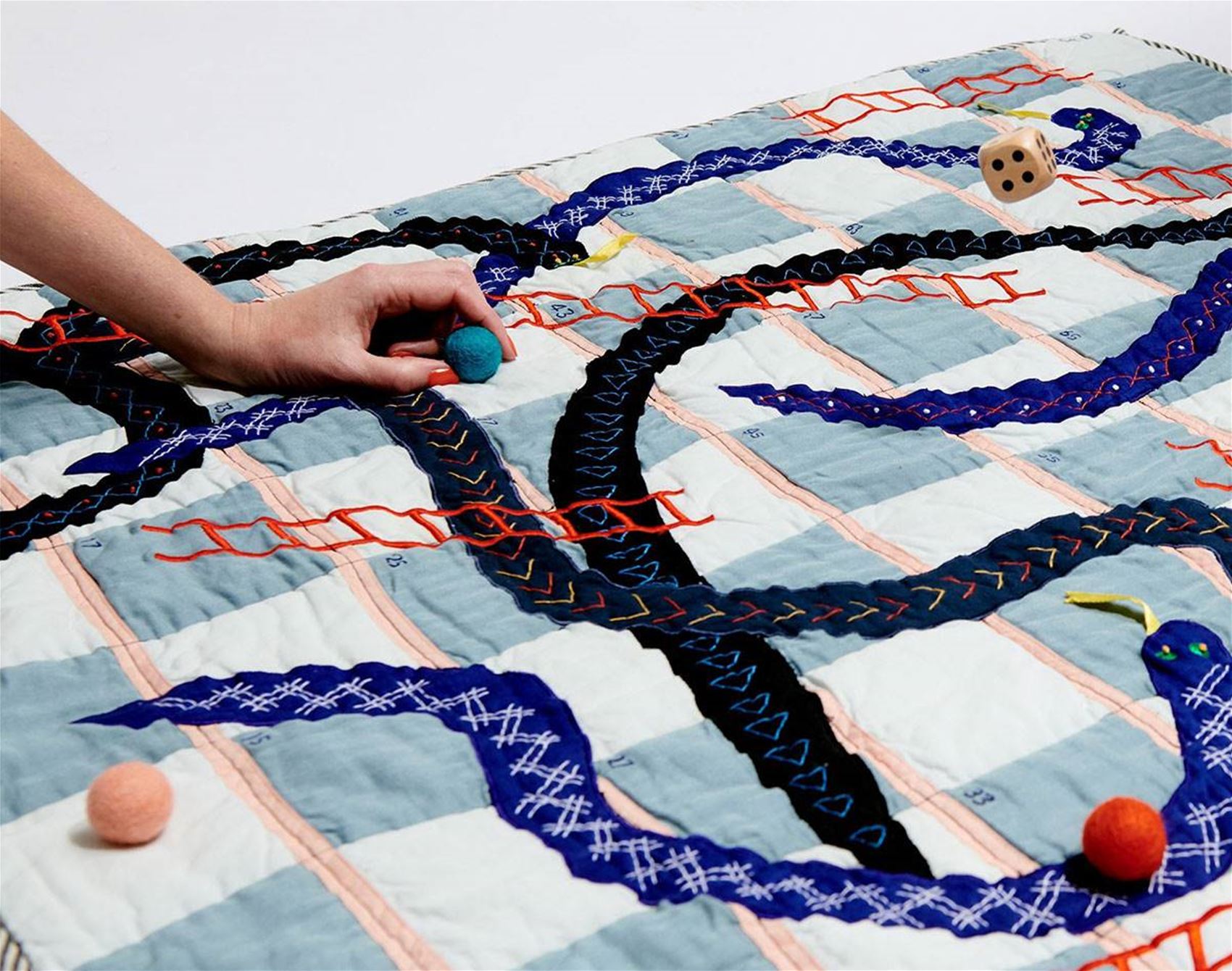 a cosy quilt and board game all in one