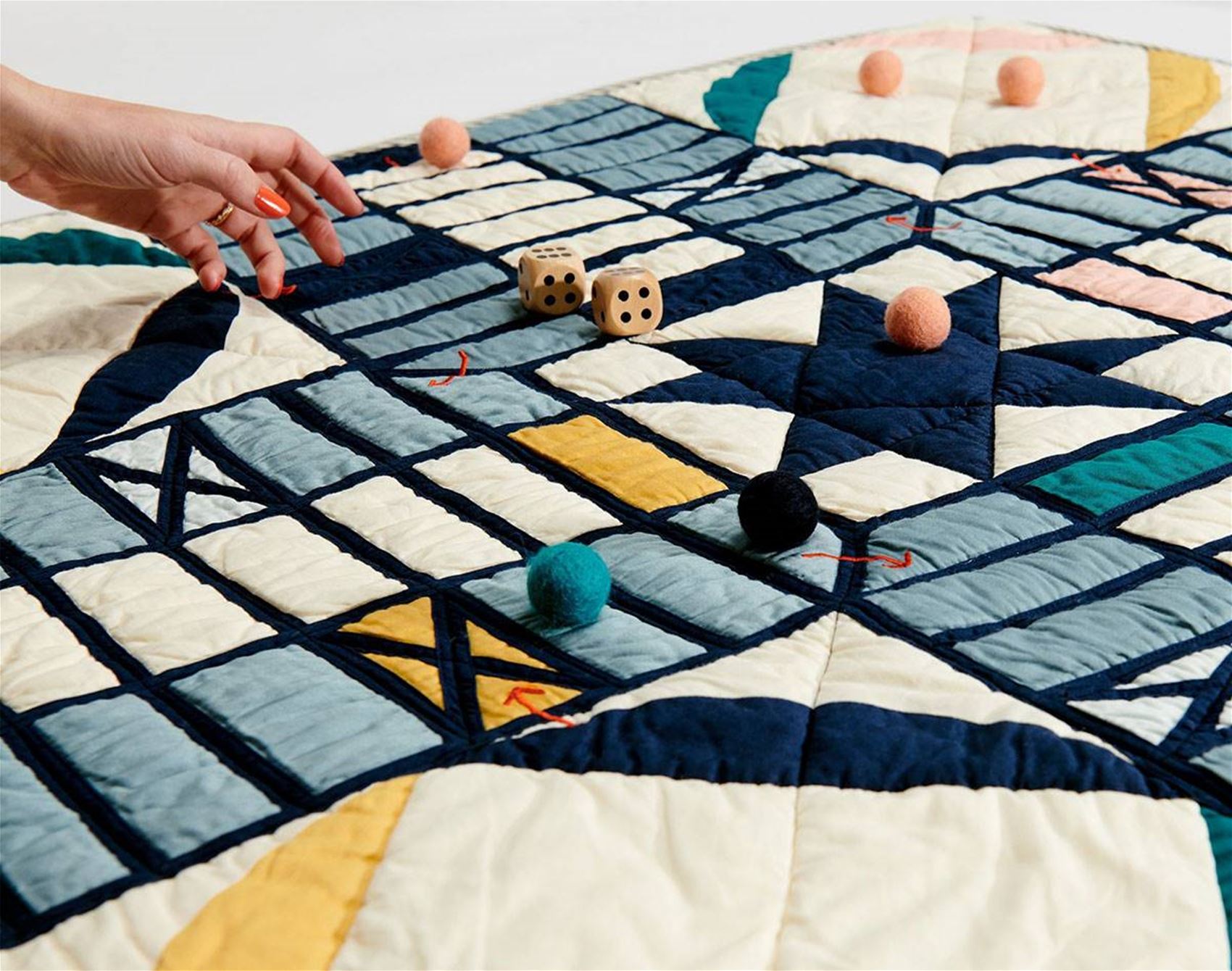 a cosy quilt and board game all in one