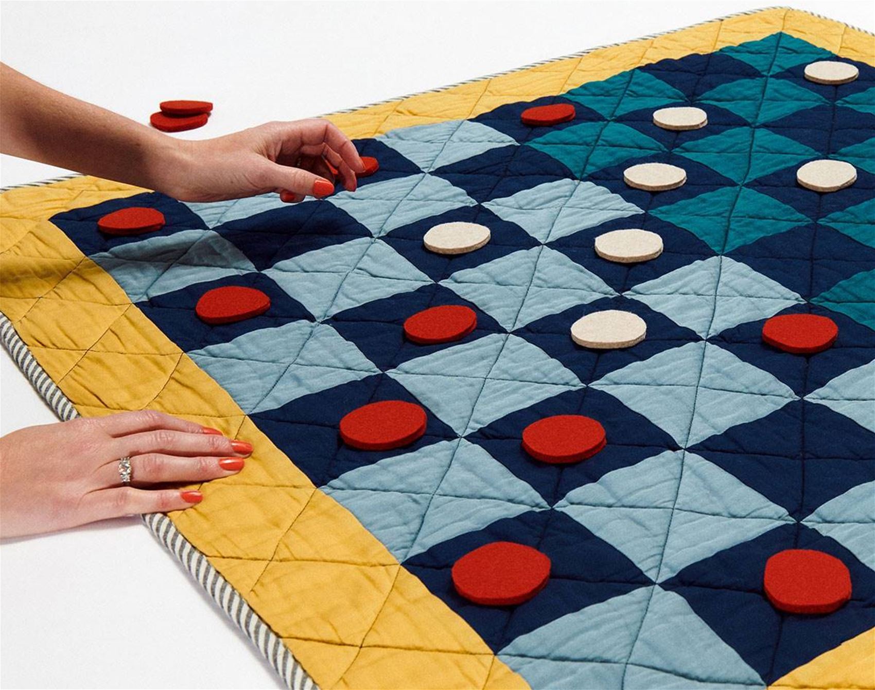 a cosy quilt and board game all in one