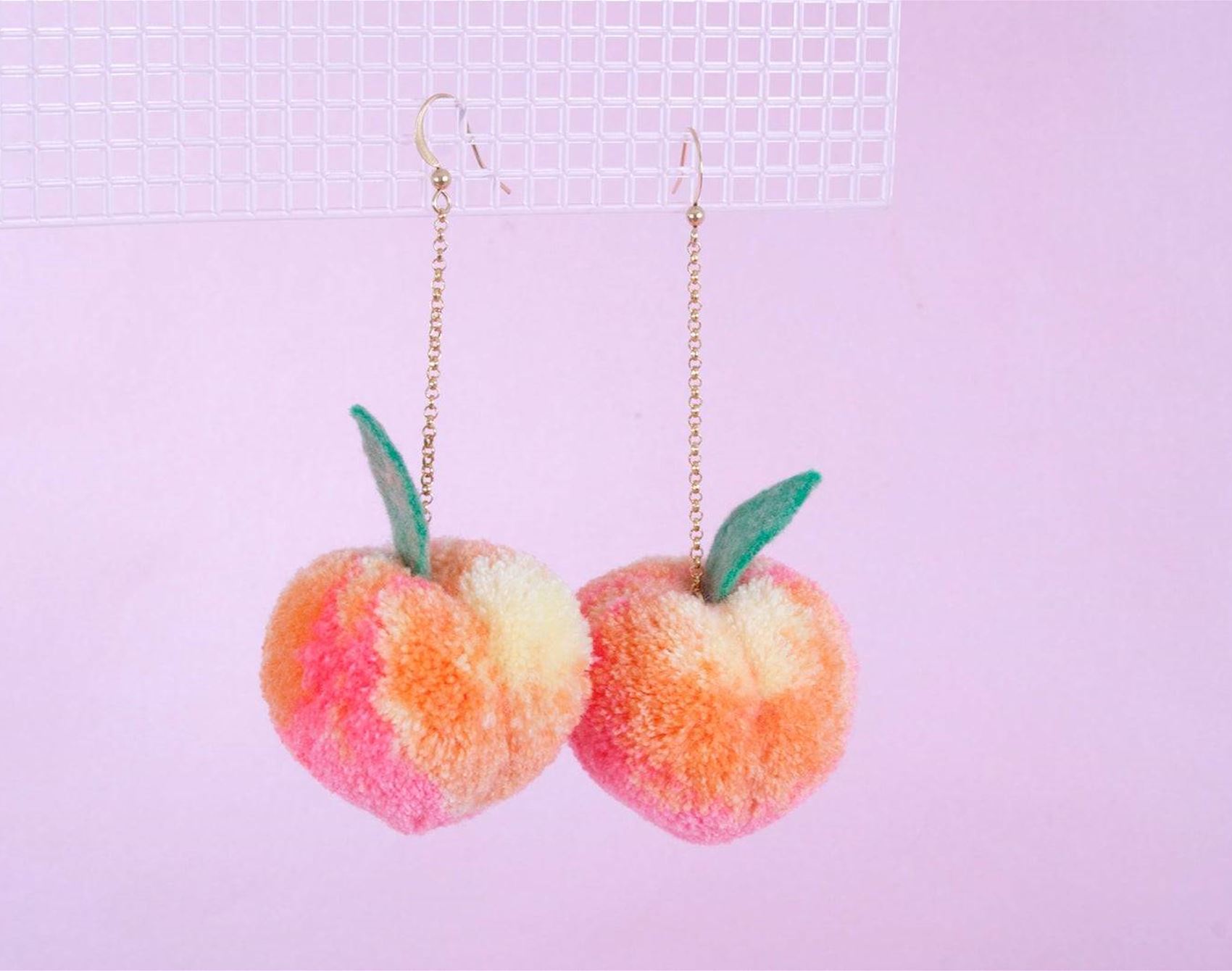 peach pom pom earrings