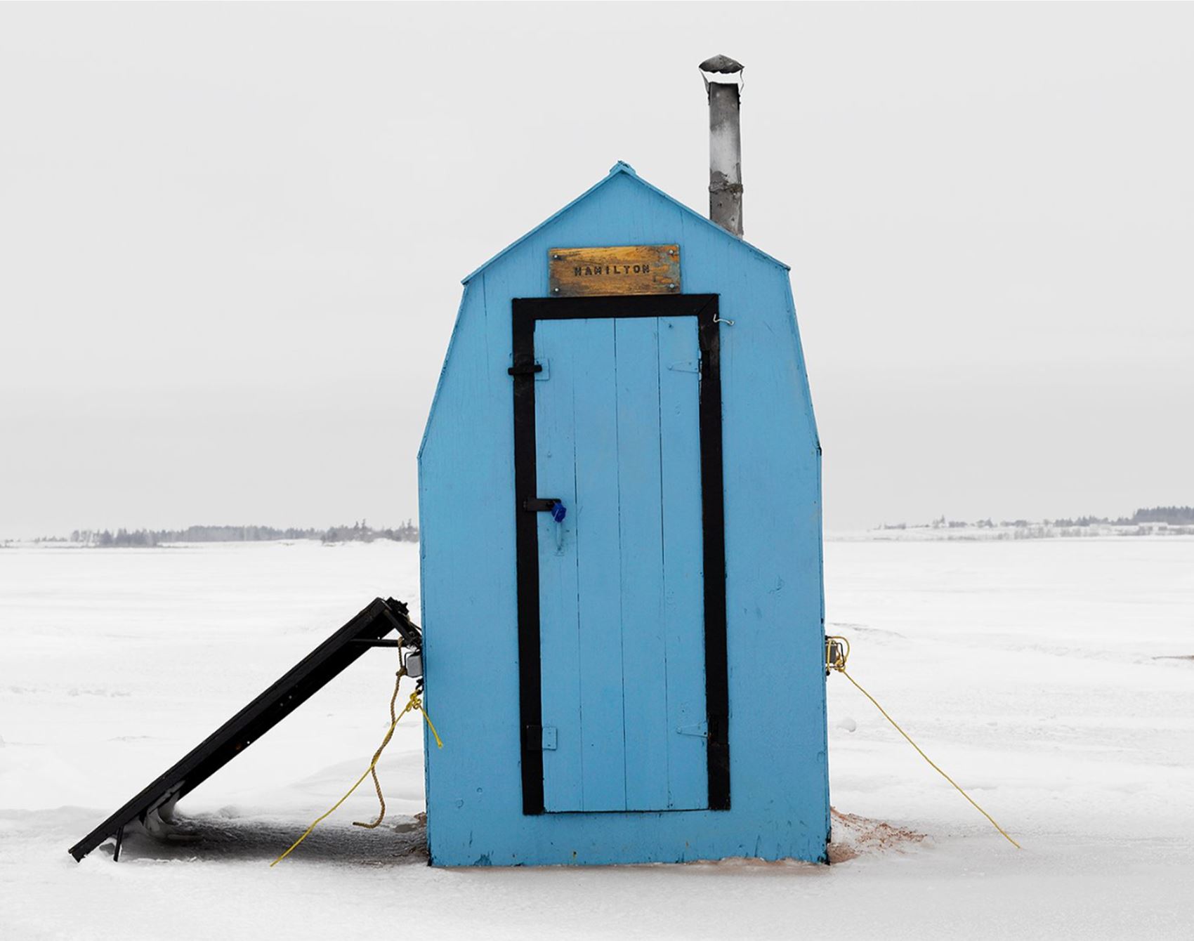 richard johnson snaps colourful ice huts in the canadian wilderness