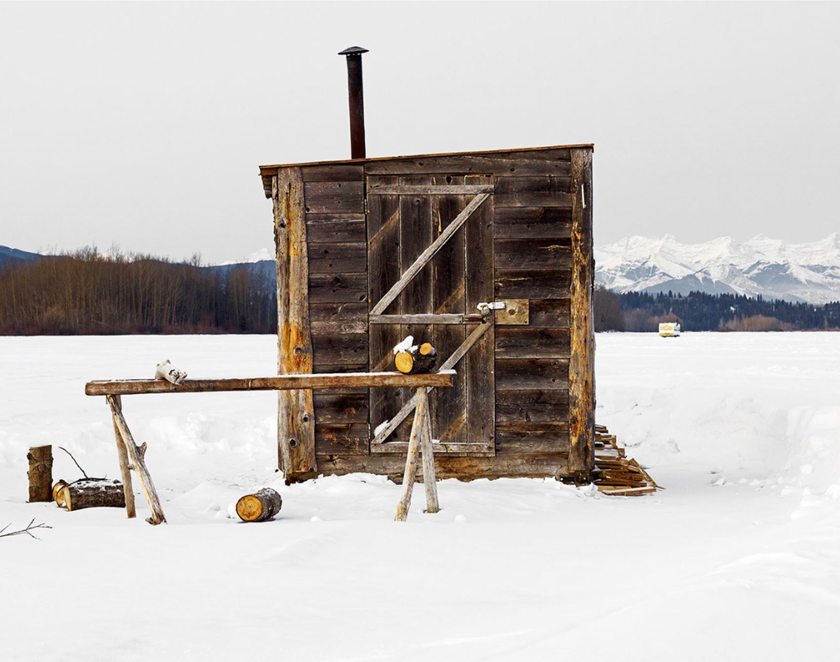 richard johnson snaps colourful ice huts in the canadian wilderness