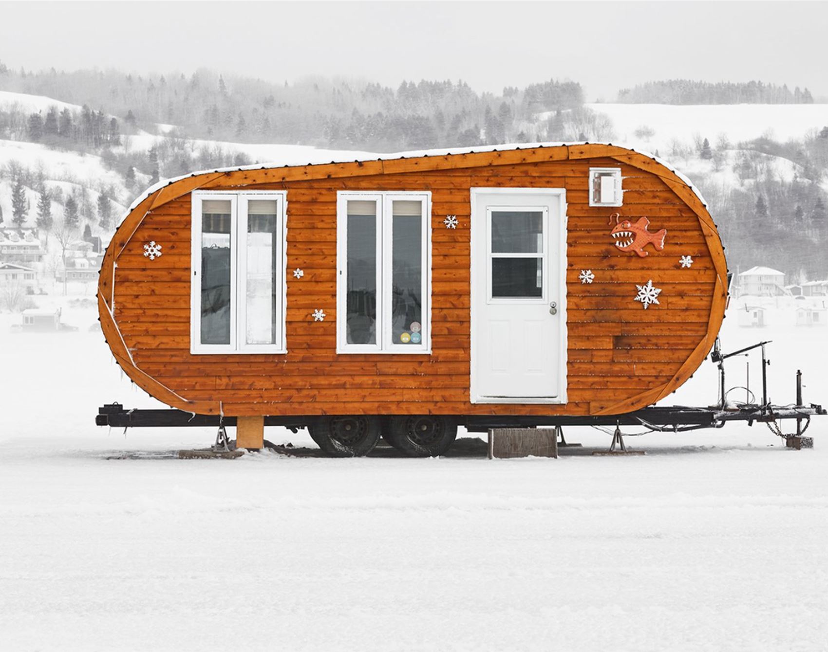 richard johnson snaps colourful ice huts in the canadian wilderness
