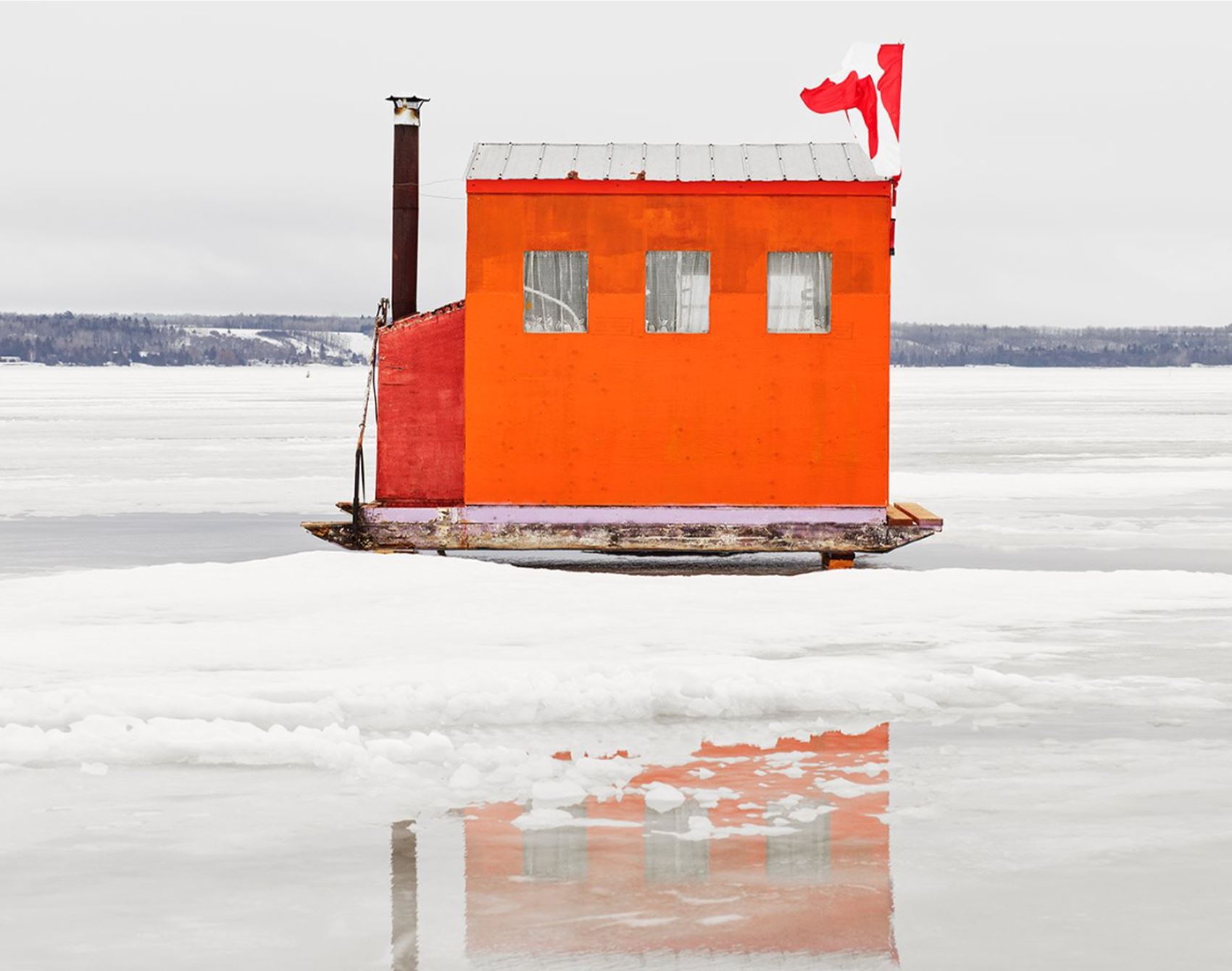 richard johnson snaps colourful ice huts in the canadian wilderness