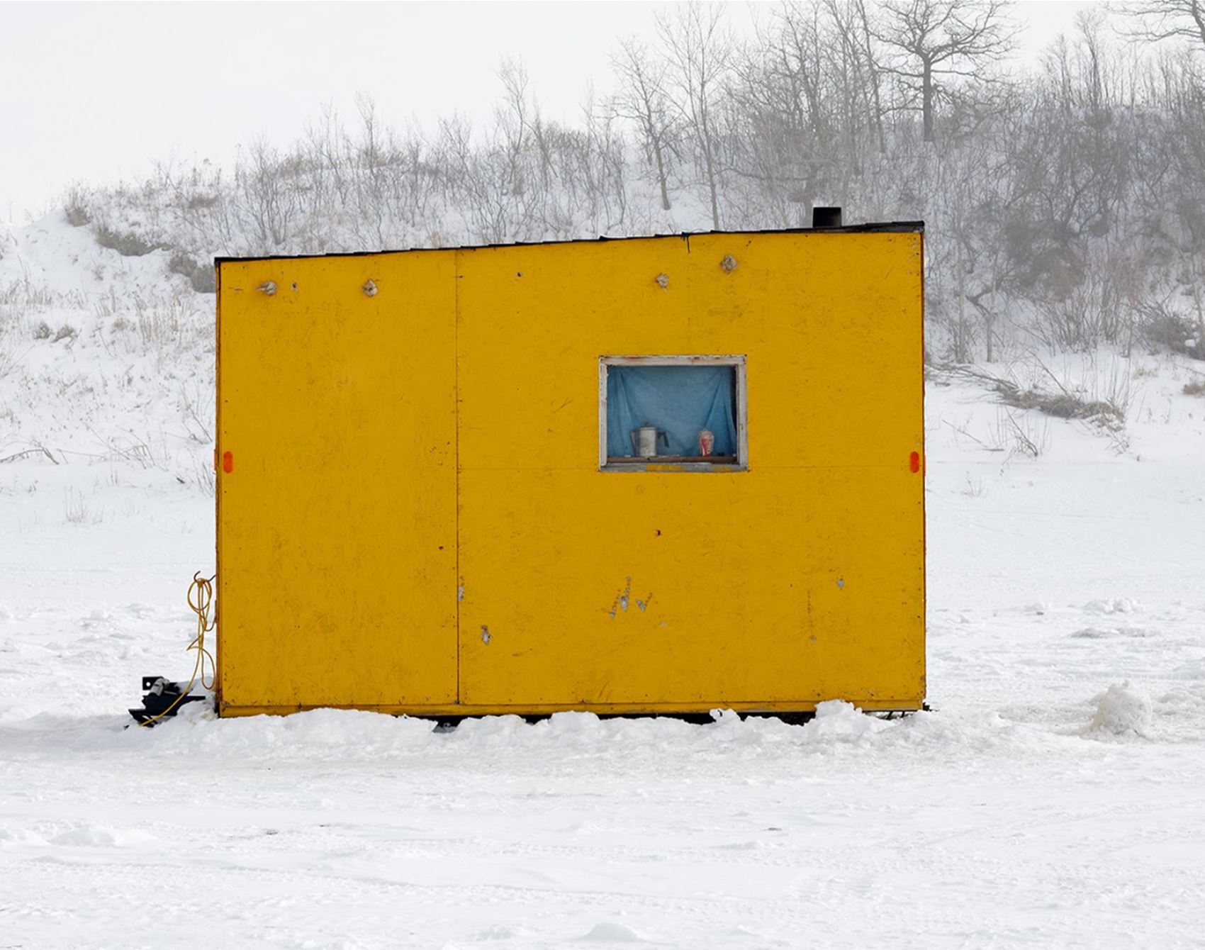 richard johnson snaps colourful ice huts in the canadian wilderness