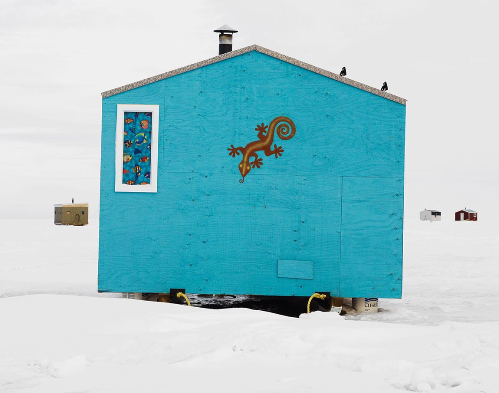 richard johnson snaps colourful ice huts in the canadian wilderness
