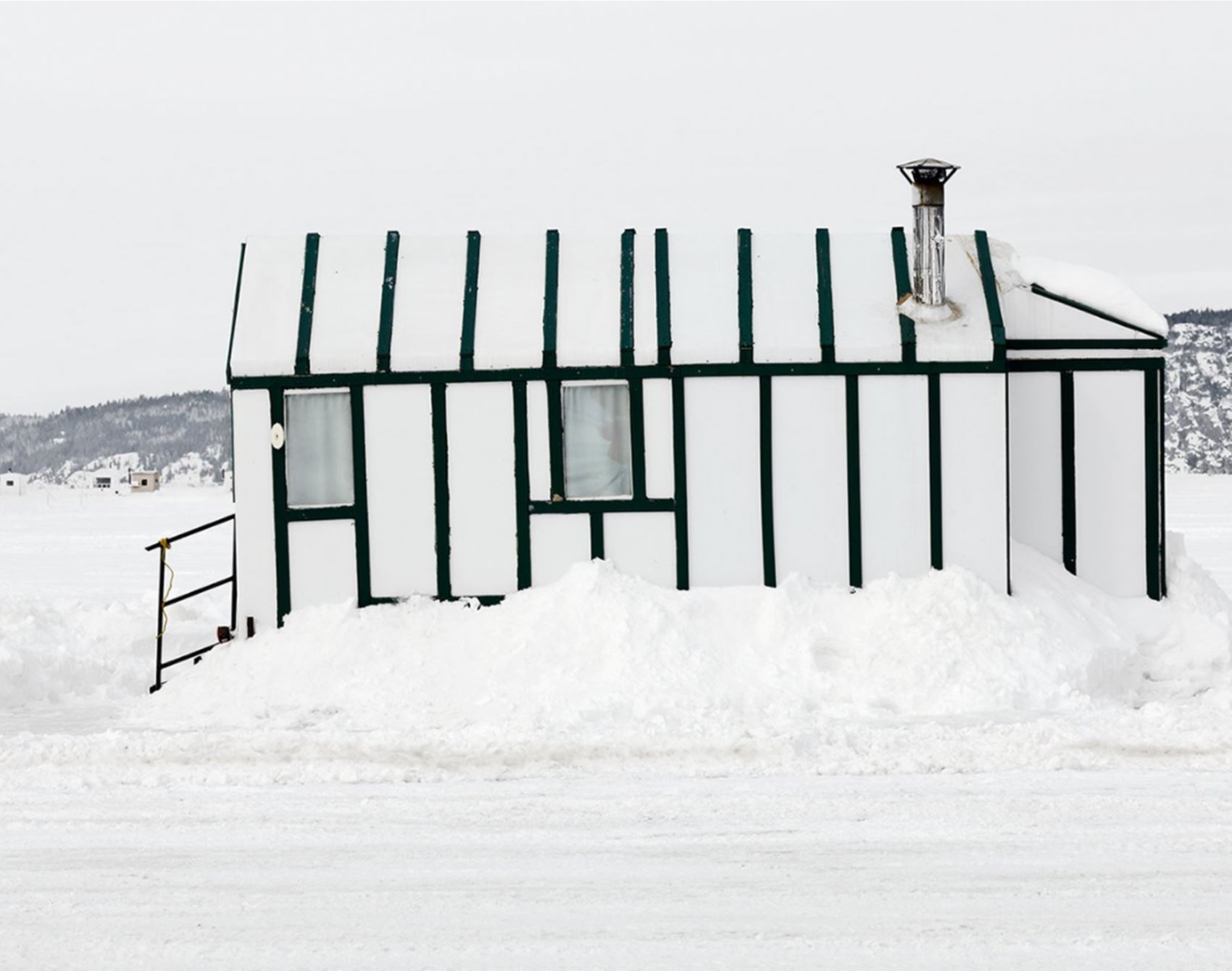 richard johnson snaps colourful ice huts in the canadian wilderness