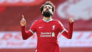 Salah's 200th goal sends 'lucky' Liverpool top of EPL