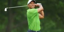 Tiger grinds to make PGA weekend
