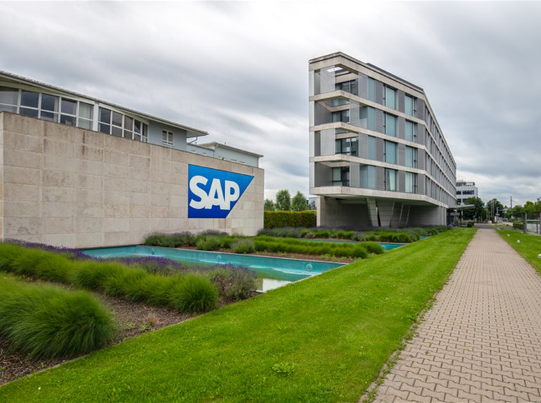 SAP's quarterly revenue beats estimates, trims 2022 profit outlook