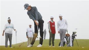 Two Aussies advance at fog delayed U.S. Junior