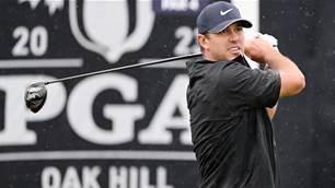 Koepka takes control at rainy PGA Championship
