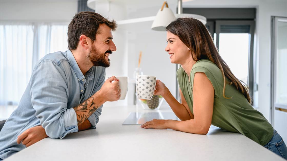 Couple enjoying coffee and a meaningful conversation at home Couple enjoying coffee and a meaningful conversation at home