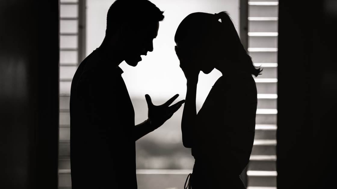 Silhouette of a couple arguing illustrating relationship stress and conflict. Silhouette of a couple arguing illustrating relationship stress and conflict.