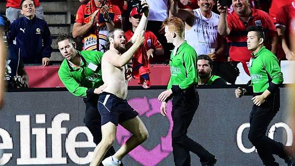 WATCH! Pitch invader's glorious FFA Cup Final stack