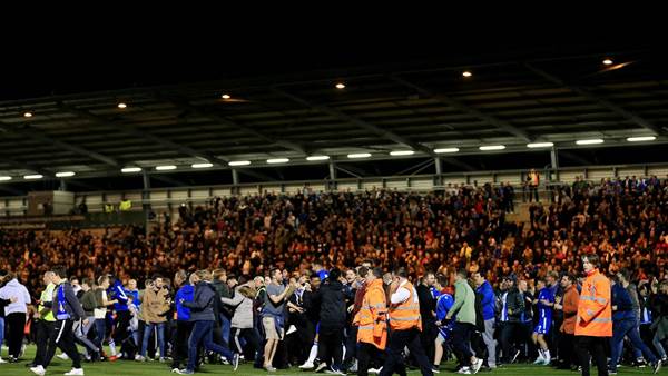 Watch! Colchester supporters storm field after historic win over Spurs