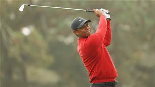 Tiger is back swinging, 271 days on from horror car smash