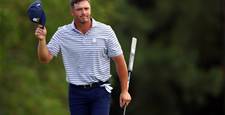 DeChambeau surges to early lead at suspended Masters