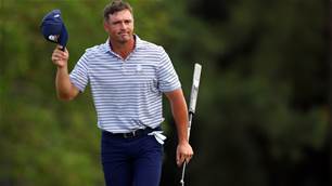 DeChambeau surges to early lead at suspended Masters