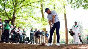 DeChambeau fights to share Masters halfway lead