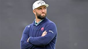 Frustrated Rahm blows time on whistling spectator
