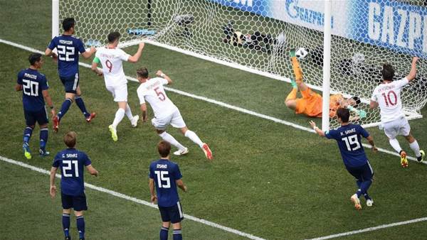 Japan reach round of 16 despite 1-0 loss to Poland