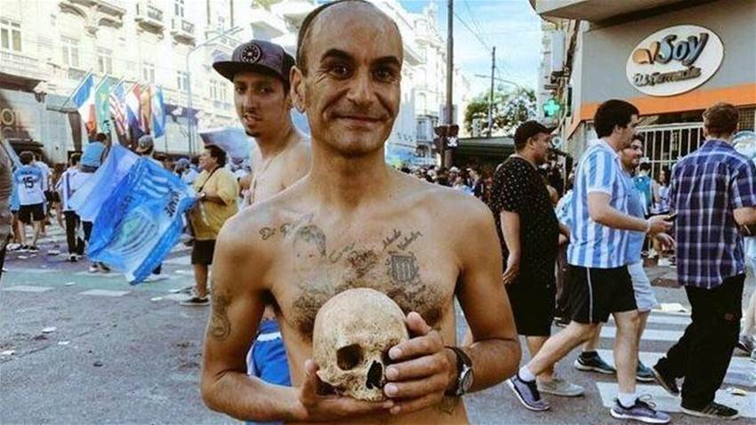 Racing Club fan brings grandfather's skull to share in title-winning celebration