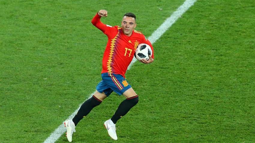 Spain finish top of Group B after salvaging 2-2 draw with Morocco