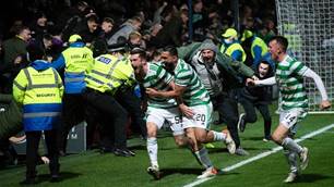 Celtic fans celebrate on pitch after Socceroo Rogi&#263; sets up win