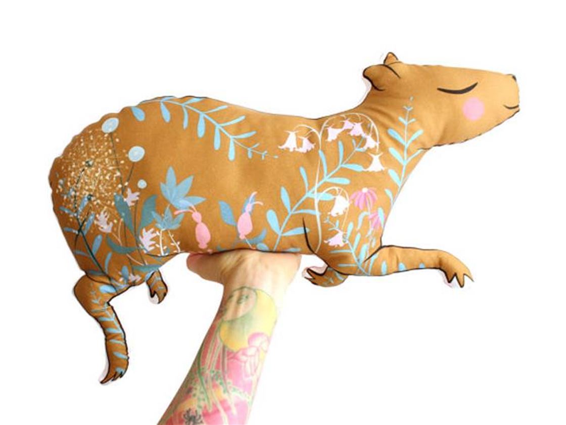 a capybara cushion a capybara cushion