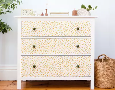 how to spruce up your dresser with wallpaper