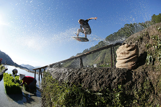 Wakeskating off a gutter