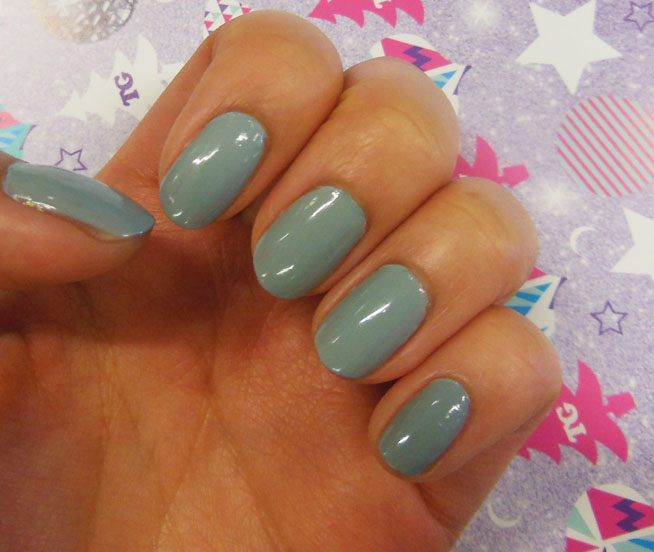 Grey nail polish on fingernails.